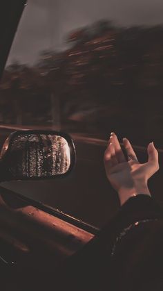 a person's hand on the dashboard of a car