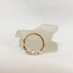 Luxury handcrafted piercing ring with unique diamond cut texturing. The ring is created using 22K yellow solid gold. Perfect for septum, daith, rook and snug piercing. The ring is stamped with 22K solid gold marking. Super comfortable, ideal for long everyday use. Will never tarnish. Made to order. Will arrive in a pretty gift box ready to give or keep. All of our jewelry is created in our home studio in Rehovot, Israel. 22K piercing jewelry: https://www.etsy.com/il-en/shop/AraDeOro?ref=seller-p Rose Gold Septum Ring, Snug Piercing, Daith Earring, Septum Hoop, Daith Jewelry, Daith Piercing Jewelry, Septum Nose Rings, Septum Piercings, Daith Earrings