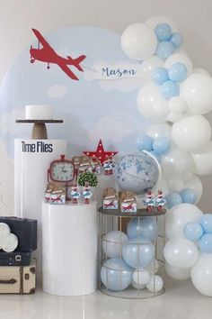 an airplane themed birthday party with balloons and decorations