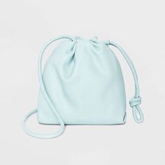 This Versatile Neutral Bag From A New Day Features A Cute Cinch Top Closure. The Exterior Is Crafted From A Light Blue Faux Leather. The Interior Has One Section And One Small Interior Pocket. The Crossbody Strap Offers A Hands Free Carry. Dimensions (Overall): 9 Inches (H) X 9 Inches (W) X 2 Inches (D). Strap Length: 47 Inches Drawstring Crossbody Bag, Neutral Bag, Outfit Aesthetic, Day Bag, Crossbody Purse, Canvas Leather, A New Day, Hands Free, Purses Crossbody