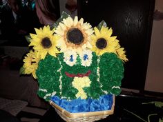 a cake made to look like sunflowers in a basket