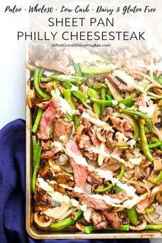 a tray filled with meat and veggies covered in sauce