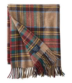 a plaid blanket with fringes on it