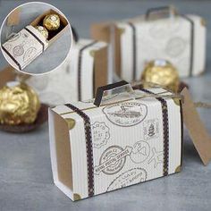 three boxes with chocolates in them sitting next to each other