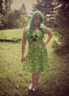 a woman with green hair wearing a dress