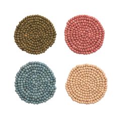 four different colored beads arranged in the shape of circles