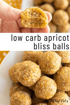 a hand holding a bite of low carb apricot bliss balls over a white plate