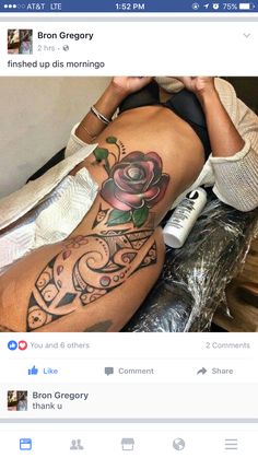 a woman's stomach with tattoos on it and an image of a rose tattooed on the side