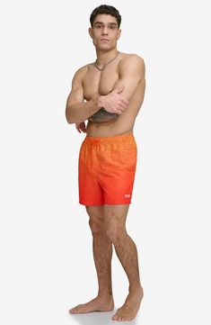 An ombré logo design brings brand flare to modern swim trunks built with UPF 40+ sun protection. 5" inseam (size Medium) Elastic/drawstring waist Front slant pockets; back patch pocket Lined 100% polyester Machine wash, tumble dry Imported Casual Swim Trunks For Water Polo, Casual Swim Trunks For Water Polo And Beach Season, Ombre Swimwear For Beach In Summer, Ombre Swimwear For Summer Beach, Summer Ombre Swimwear For The Beach, Summer Beach Ombre Swimwear, Casual Ombre Bottoms For Summer, Gradient Swimwear For Summer Poolside, Gradient Swimwear For Pool In Summer