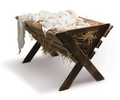 a baby jesus in a manger with hay and cloth on the sides, surrounded by sticks