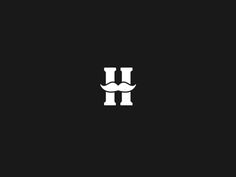 the letter h with a mustache on it's head is shown in black and white