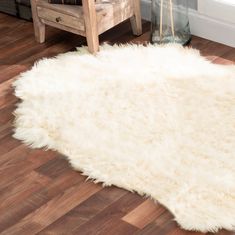 Fluffiest, plushest faux sheepskin rug: Walk on Me should be a top contender if you're looking for the silkiest, softest rugs for your living room. This faux sheepskin area rug is so plush it makes you feel like you're petting an arctic polar bear - it's even beautifully shaped like one too. Feels and looks authentic: fashion-forward thinkers realize how one unique item - in this case, one genuine-looking sheepskin shag carpet that furnishes a wealthy, luxurious ambiance without the guilt of har Faux Sheepskin Rug, Authentic Fashion, Shag Carpet, Washable Area Rug, Sheepskin Rug, Soft Rug, Washable Area Rugs, Walk On, Polar Bear