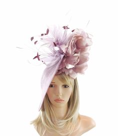 Spring Summer Hat & Fascinator Collection Ariel Sinamay Feather & Silk Fascinator Gorgeous trimmed feathers surround large silk rose with a large saucer sinamay base Base measures about 12 inches wide All designs are made to order especially for you so if you want to add a colour, change something just email us. We can do this in many colours, if your colour isnt listed email us. It is mounted with a matching headband. If you prefer we can match to your hair colour, just let us know in the notes Elegant Feather Trim Headpieces For Spring, Elegant Fitted Hats With Feather Trim, Fitted Wedding Hats With Feather Trim, Fitted Wide Brim Fascinator With Feather Trim, Fitted Wedding Hat With Feather Trim, Elegant Adjustable Top Hat With Feather Trim, Elegant Spring Headpieces With Feather Trim, Elegant Fitted Feather Trim Headband, Elegant Feather Trim Headband Hat