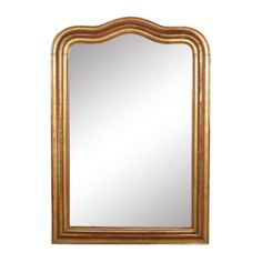 a gold framed mirror on a white wall