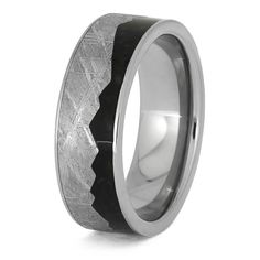 Say "I do" with a bang with this out of this world meteorite mountain ring with crushed dinosaur bone! Featuring a a bold mountain design and a dinosaur bone inlay made from a million-year-old fossil, this alternative wedding band is sure to make your special day and every day extra special. RING LAYOUTRing Width: 8 mmRing Sleeve: TitaniumRing Profile: FlatRing Finish: Polished 0.5 mm Titanium3.5 mm Crushed Dinosaur Bone3.5 mm Gibeon Meteorite (Jagged Mountain Design)0.5 mm Titanium Gibeon Meteorite, Alternative Wedding Bands, Meteorite Jewelry, Mountain Ring, Mountain Design, Engraving Fonts, Dinosaur Bones, Special Ring, Mountain Designs