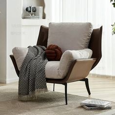 a living room with a chair and pillows on the floor