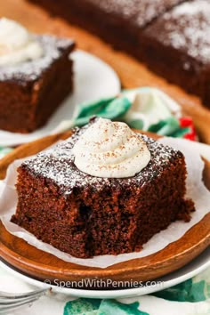 a piece of chocolate cake with whipped cream on top