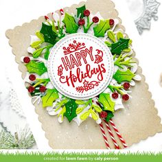 a christmas card with holly and candy canes