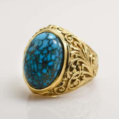 For Sale on 1stDibs - Men's 14k yellow gold and turquoise ring. Stamped 14k and tests 57% gold with an XRF gun. Gross weight is 29 grams. The spider web turquoise measures 20mm Gold Oval Hallmarked Turquoise Ring, Formal Gold Turquoise Ring In 14k Gold, Formal Turquoise Ring In 14k Gold, Gold Turquoise Cabochon Ring In 14k Gold, The Spider, Spider Web, Cocktail Rings, Turquoise Ring, Yellow Gold