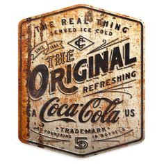 the original refreshing coca - cola sign has been altered to look like an old tin can