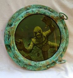 an image of a creature in a porthole window