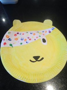 a paper plate with a bear's head on it