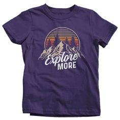 "Kids Hiking T Shirt Hiker Shirt Explore More Mountains Shirt Hiker Gift Camping Tee Mountains Shirt Boy's Girl's Youth Get there when you do! Hiking can be so freeing. This t shirt is perfect for any hiker or camper. It features vintage colors, a mountain range and distressed fonts. It simply reads 'Explore More'. Made of soft, ring spun cotton. Includes a drawstring cotton gift bag. Direct to garment printed using the latest technology. Soft, ring spun cotton. Please check out my other Etsy It Graphic Print Cotton Top For Outdoor Activities, Cotton Tops With Front Print For Outdoor Activities, Adventure Graphic Cotton Tee, Adventure Graphic Cotton Tee Shirt, Outdoor Short Sleeve Slogan Tops, Short Sleeve Tops With Text Print For Adventure, Outdoor Slogan Crew Neck Top, Outdoor Slogan Tops With Crew Neck, Pre-shrunk Graphic Tee For Adventure