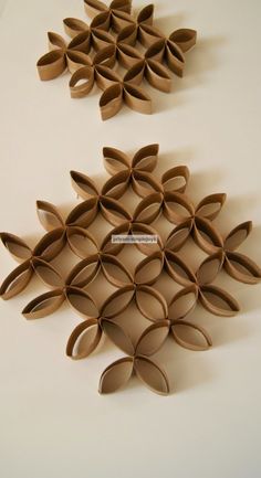 two pieces of cardboard are arranged in the shape of leaves