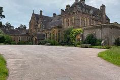 an old building with a large driveway in front of it