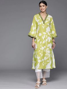 Get ready to be the center of attention with this quirky Lime Green Cotton Printed Kurta. Featuring sparkling sequin detailing, this kurta is perfect for adding some fun and playfulness to any outfit. The soft cotton fabric guarantees ultimate comfort while the vibrant lime green color will make you stand out in the crowd. Add a touch of spunk to your wardrobe with this unique kurta. No. of pieces - 1 piece. Color - Lime Green. Fabric - Cotton. Washing Instructions - Dry Clean. Bollywood Style Kurta With Mirror Work For Spring, Green Sequined Straight Kurta, Spring Cotton Kurta With Mirror Work, Bollywood Style Festive Spring Top, Spring Embellished Long Sleeve Kurta, Spring Party Kurta With Mirror Work, Summer Long Sleeve Kurta With Mirror Work, Festive Cotton V-neck Kurta, Summer Party Kurta With Gota Work