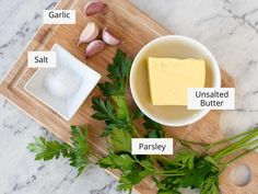 ingredients to make garlic butter on a cutting board