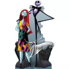 a figurine is standing next to a skeleton