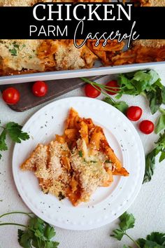 chicken parmesan casserole on a white plate with tomatoes and parsley