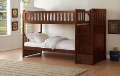 a wooden bunk bed sitting on top of a hard wood floor next to a window