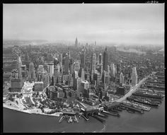 an aerial view of a large city with lots of tall buildings in the middle of it