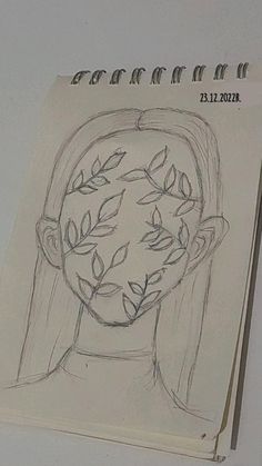 a drawing of a woman's face with leaves on her head and branches growing out of it