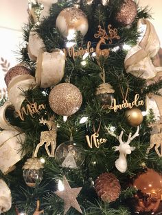 a christmas tree decorated with gold and silver ornaments