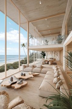 a living room filled with lots of furniture next to the ocean