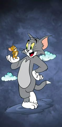 the cartoon cat is holding a mouse in his hand and pointing to it's left