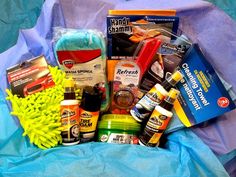 the contents of a cleaning kit laid out on a blue cloth