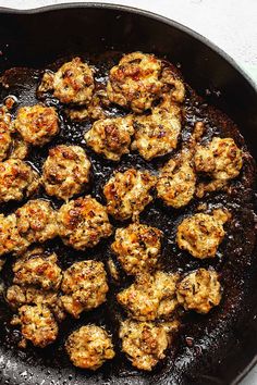 some meatballs are cooking in a skillet on the stove and is ready to be eaten