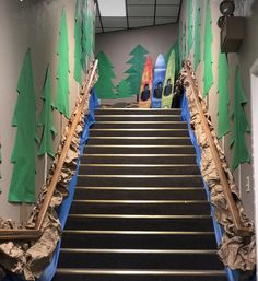 the stairs are decorated with trees and surfboards on them, along with other decorations