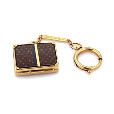 a louis vuitton keychain is shown with a ring on the bottom