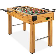 a foosball table is shown with two red balls on it