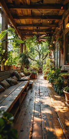 an outdoor patio with wooden benches and potted plants