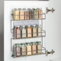 three tiered spice rack with jars and spices