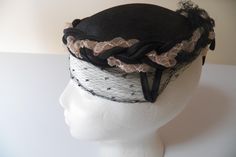 This is a 1950's MIDCENTURY JULIET CAP HAT that is Black with a woven lace encrusted with tiny beads. It has a black veil and two velvet back tabs that each have a tiny white RHINESTONE on the tab. It is a truly UNIQUE Vintage hat..One of a kind! This Rare Find is in Great Condition, and will be spectacular with your Mid Century Outfits! ONLY ONE AVAILABLE. Vintage Adjustable Headpieces For Evening, Adjustable Vintage Headpieces For Evening, Vintage Fitted Cloche Headpiece, Vintage Fitted Formal Headpieces, Adjustable Vintage Mini Hats For Costume, Juliet Cap, Tiny Beads, Fashion 1950s, Beauty Dress