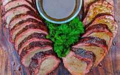 sliced meat and sauce on a cutting board