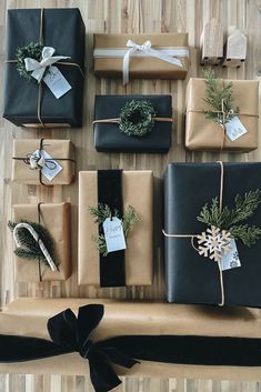 presents wrapped in brown paper and tied with twine on top of a wooden table