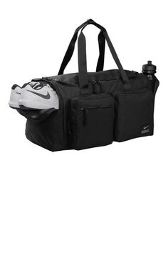 The Utility Duffel keeps your gear secure and ready to use while you’re working toward your next level of fitness. Multiple pockets organize training essentials, while several handles offer versatile carrying options. 100% polyester Zippered main compartment for spacious, secure storage Durable construction helps keep cargo safe when you’re on the move Adjustable shoulder strap and handles at the top and side offer comfortable carrying options Exterior zippered pockets keep small items close and organized Built-in ventilation lets gear breathe Dimensions: 22"l x 11"w x 12"h; Approx. 3,113 cubic inches Nike Bags, Nike Hat, Pocket Organizer, Embroidered Caps, Custom Nikes, Personalize Bag, Face Cover, Duffel Bag, Nike Dri Fit